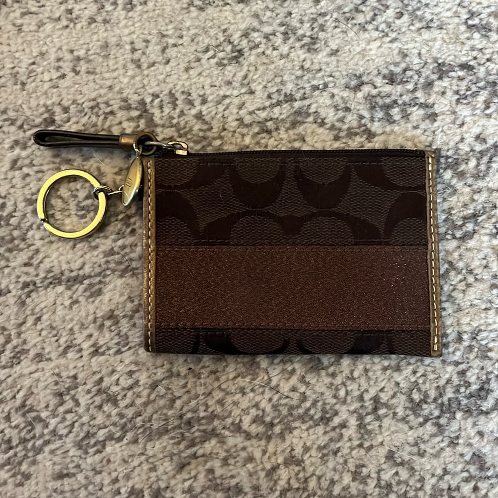 Coach coin purse with pocket and key ring.